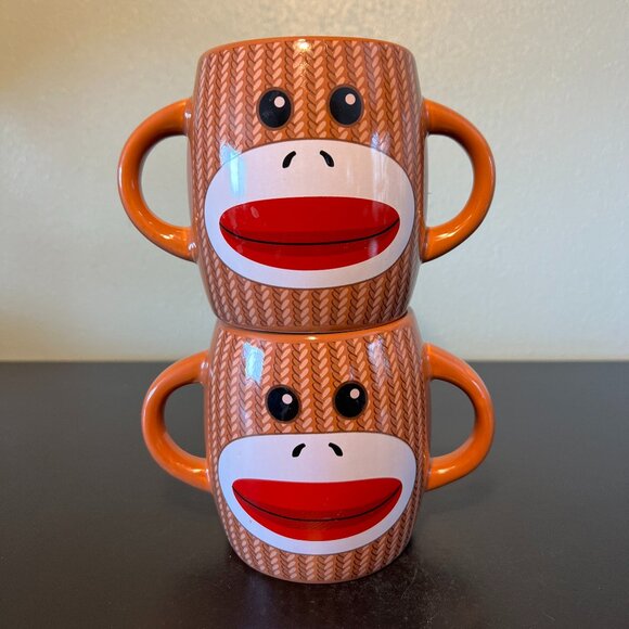 Set of 2 Knitted Sock Monkey Ceramic Dual Handled, Double Sided Mugs - GALERIE - Picture 1 of 7